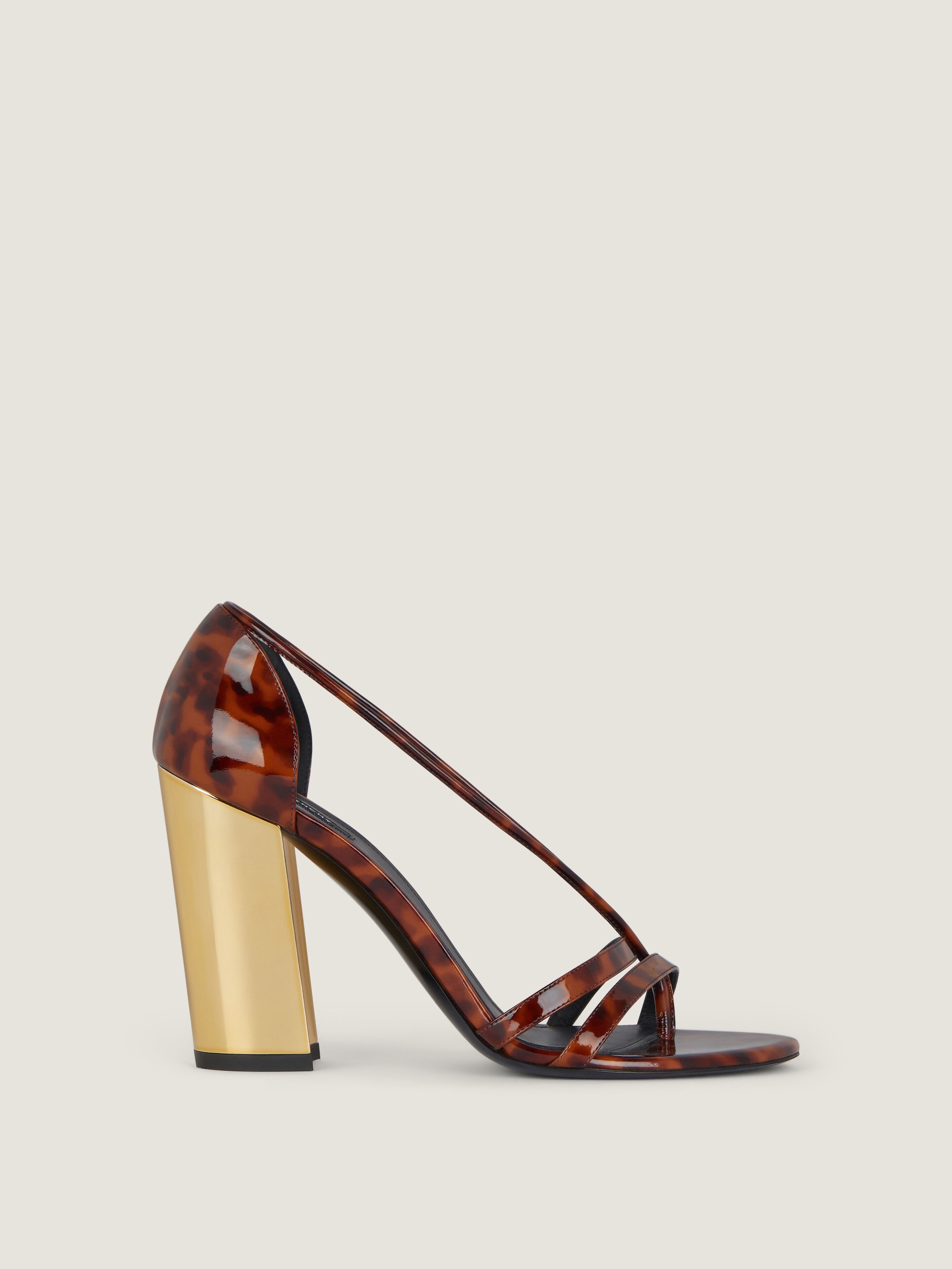 Block heeled sandals in tortoise shell patent leather